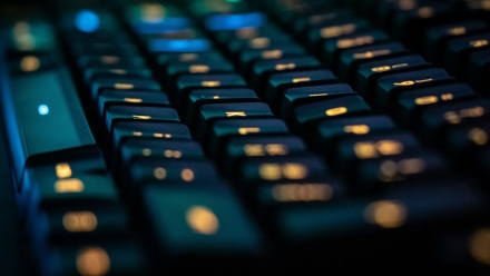 A keyboard with orange backlighting