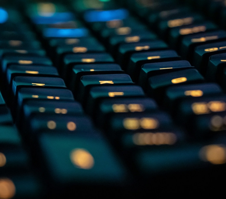 A keyboard with orange backlighting
