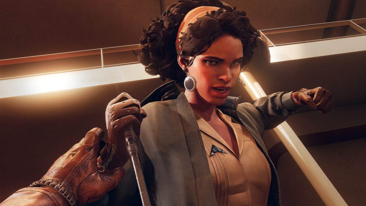 Julianna from Arkane Lyon's Deathloop raising her weapon in a close-up
