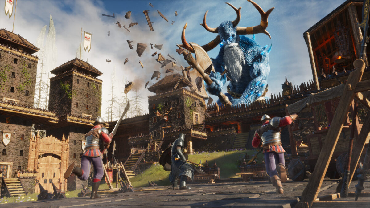 A giant blue-horned god avatar towers over a stone castle under siege in Conan Exiles Enhanced