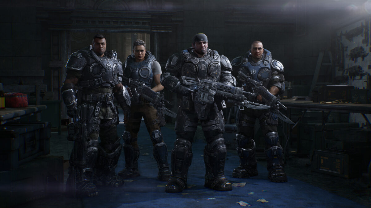 Gears of War: E-Day screenshot of four COG soldiers standing in a dim garage with their Lancers