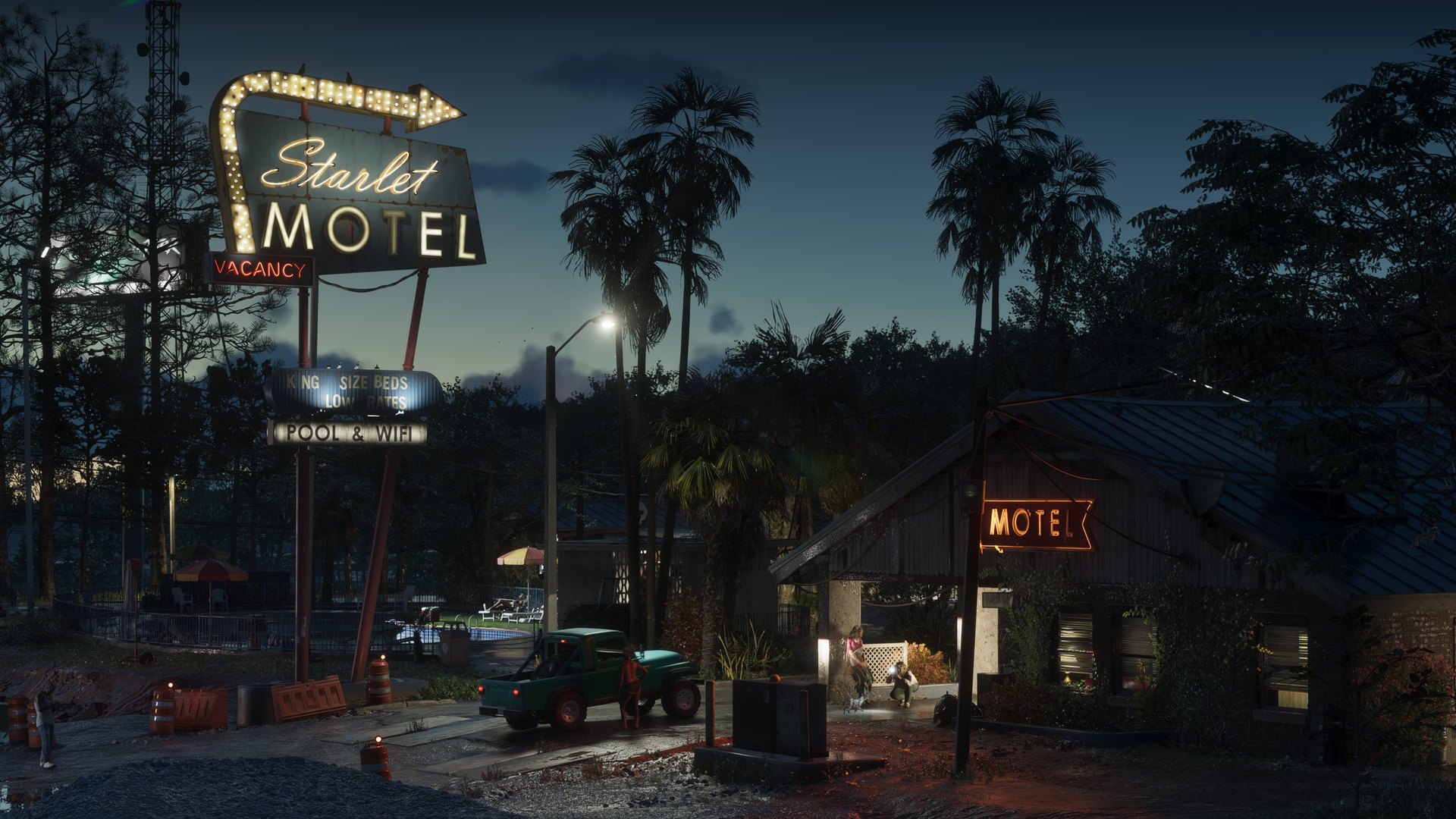 A motel with a lit vacancy sign in Port Gellhorn at night, GTA 6