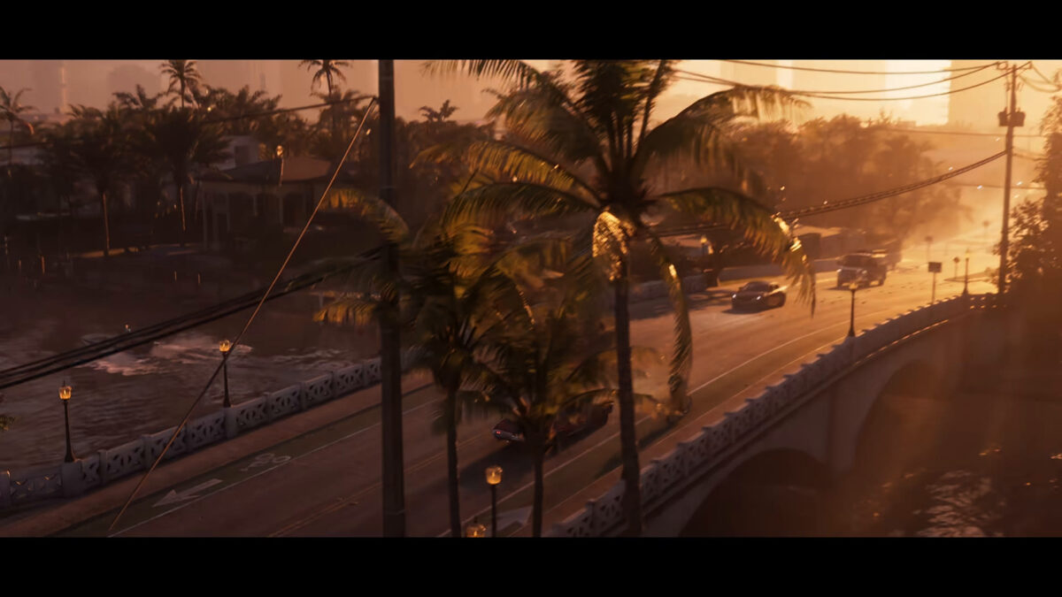 A sunset street with palm trees and a bridge in Vice City from the GTA 6 trailer