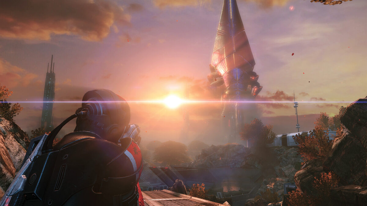 Commander Shepard looking out over a sunset skyline in Mass Effect Legendary Edition