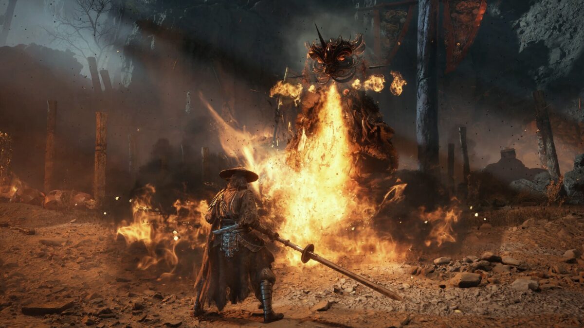 Phantom Blade Zero screenshot of the protagonist Soul in a straw hat holding a sword before a huge flaming demon, from the official Steam page