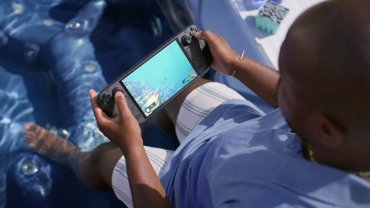Hands holding a Steam Deck OLED running Dave the Diver, one of the handhelds HelixSR 3.1 brings FSR 4 upscaling to